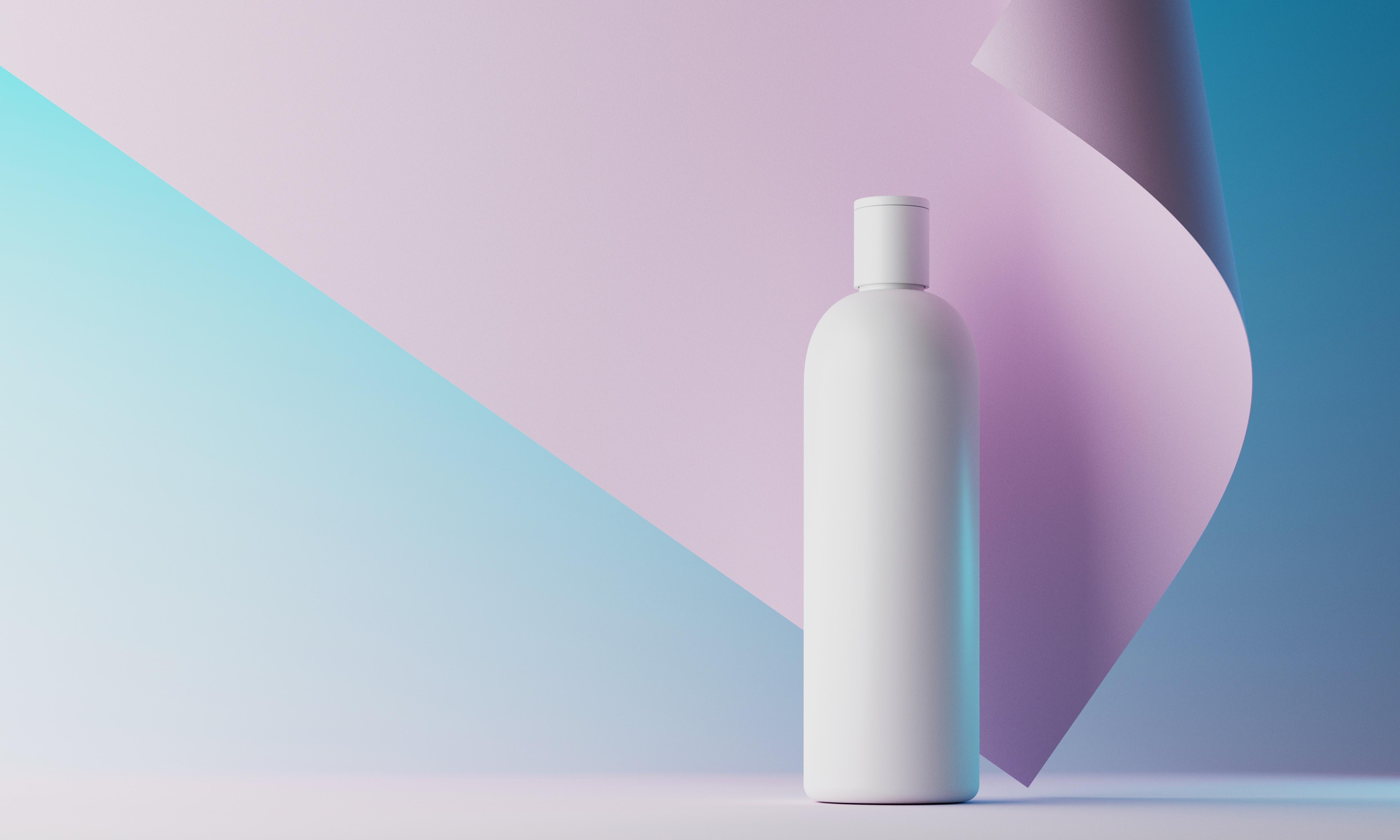 cosmetic bottle in front of colored background